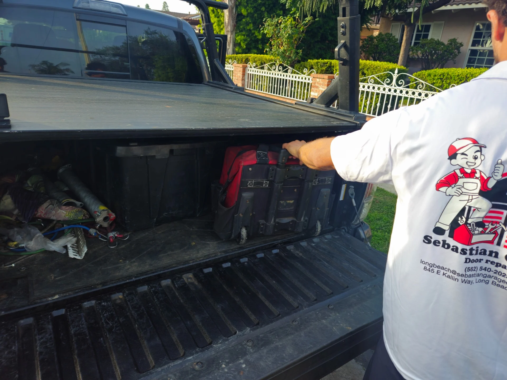 Sebastian technician beside the company truck