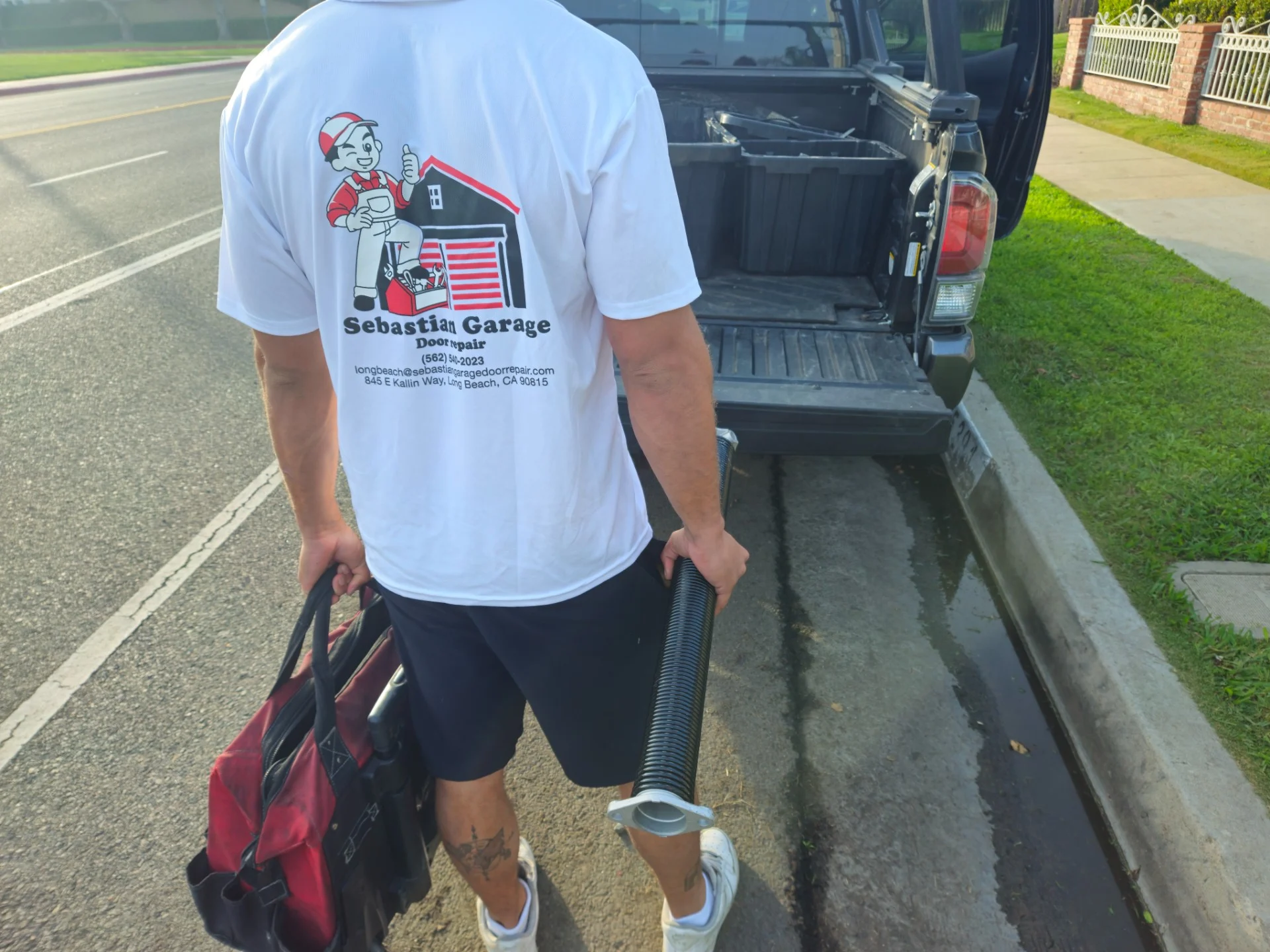 Sebastian technician beside the company truck